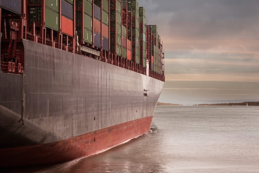 Huge cargo ship sailing towards port